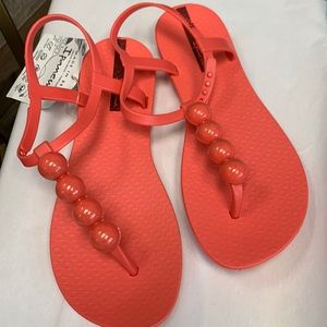 Coral colored Ipanema sandals size 7. Brand new never worn.